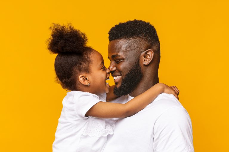 African daddy and his little daughter touching noses
